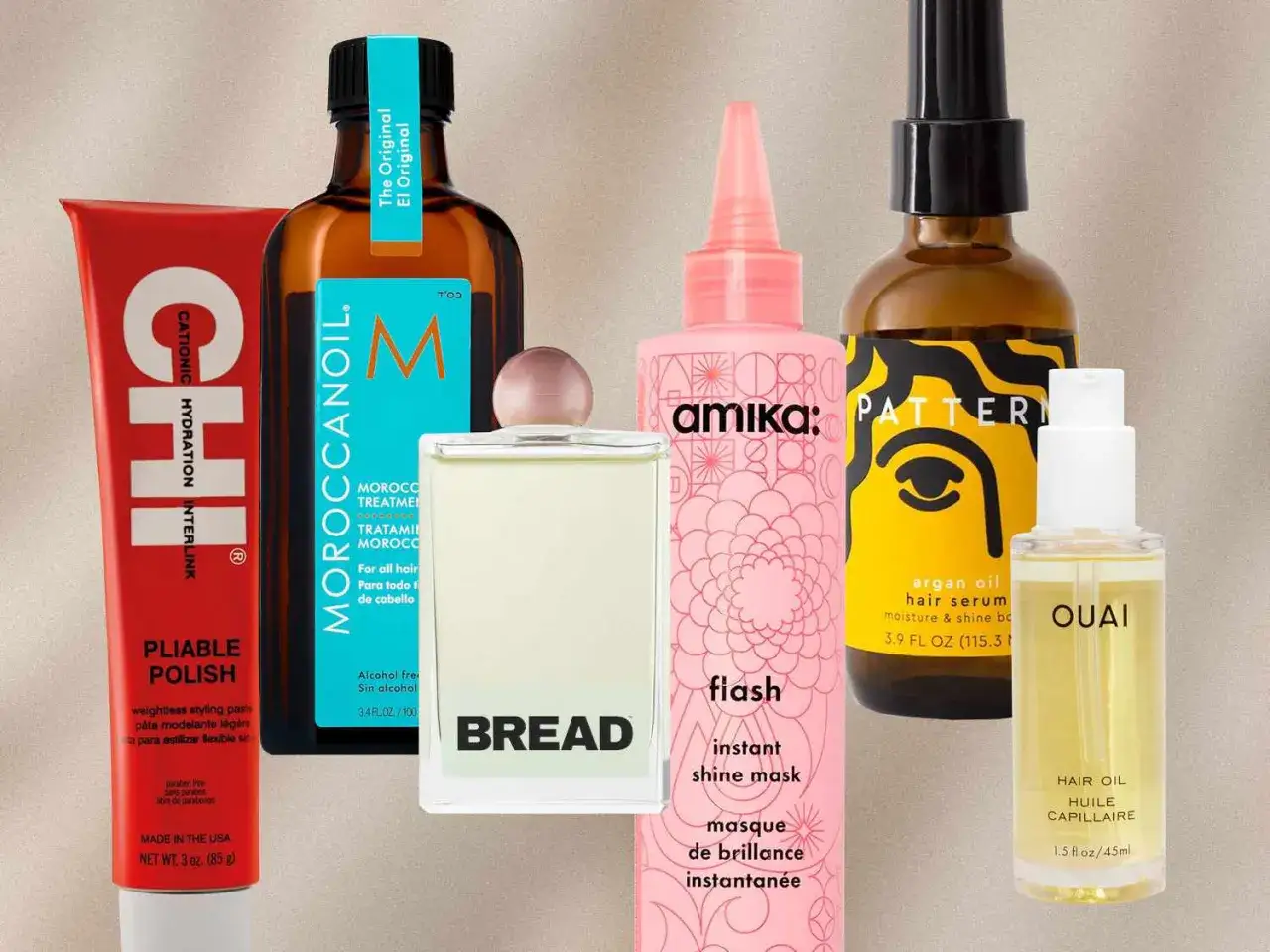 En samling h&aring;rprodukter, inklusive en flaska Moroccanoil och en flaska med arganolja f&ouml;r glans.